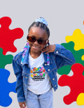 Girl in sunglasses and a denim jacket wearing the white Different Abilities, Brighter Tomorrows tee by 4C Sensory Center